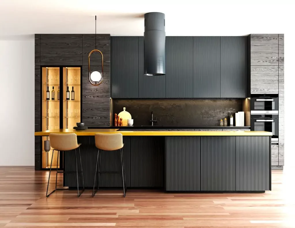 A kitchen with black cabinets and yellow counter.